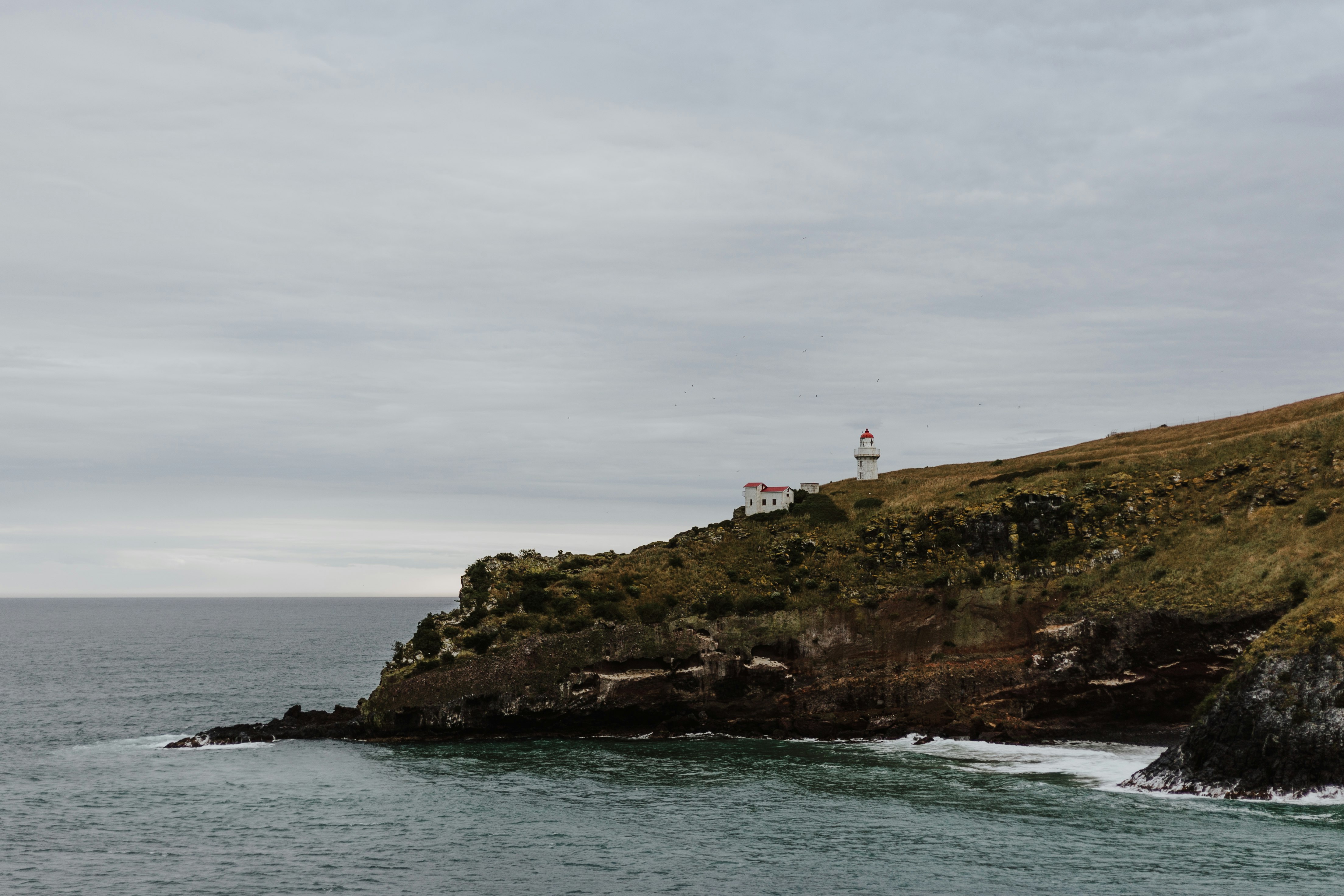 white house near the cliff